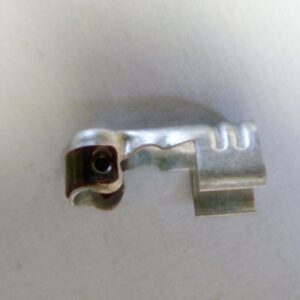 A 90 degree steel crimp boot style spark plug terminal on a white surface.