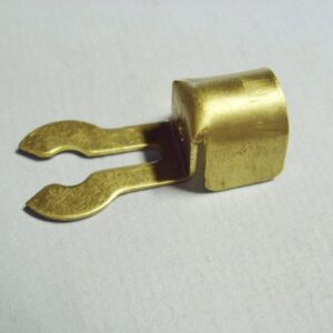 A 9mm forked brass spark plug terminal with two holes on it.