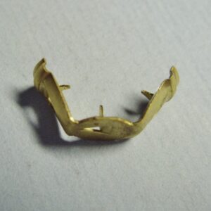 A small 9MM standard distributor cap/coil terminal on a white surface.