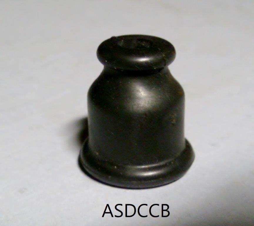 Antique style distributor cap or coil boot.