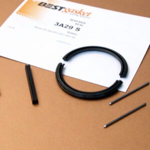 A set of screws and a piece of paper on a table.