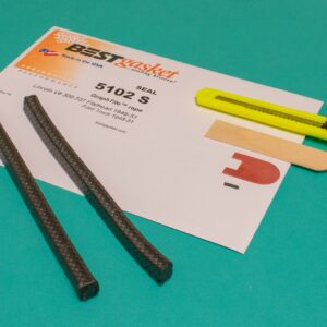 A pair of scissors and a piece of paper on a table.