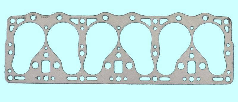 A metal gasket with four holes on it.
