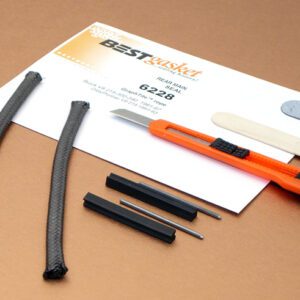 A set of tools and a piece of paper on a table.