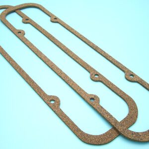 A 1961-81 Pontiac V8 valve cover gasket set on a blue surface.