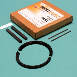 A box with a set of tools and a Ford V8 312 Y-Block rubber rear main seal.