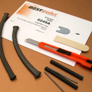 A set of tools and a 1958-64 Ford Products V8 rope rear main seal on a table.