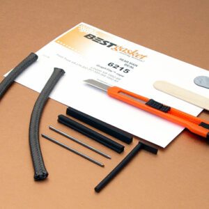 A set of tools and a 1952-68 Lincoln V8, 1952-63 Ford Truck V8 rope rear main seal on a table.