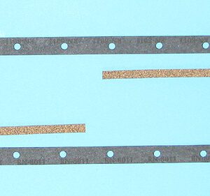 A pair of metal gaskets on a blue background.