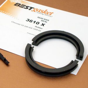 A pair of black rubber seals on a piece of paper.