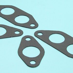 Four pieces of gaskets on a blue surface.